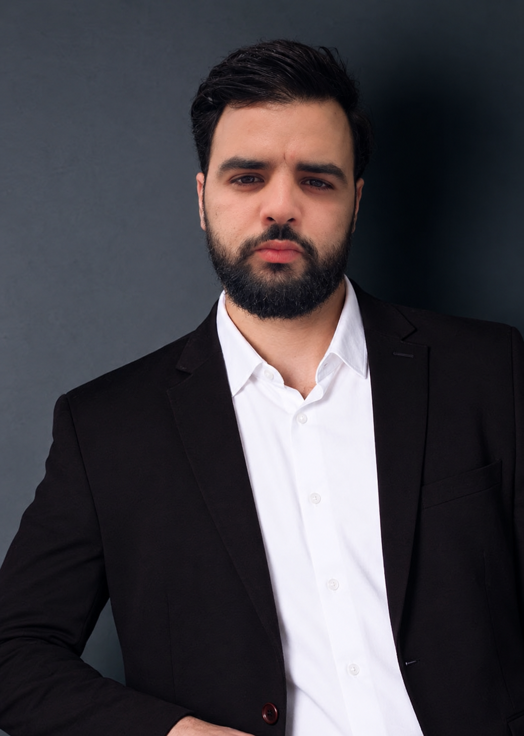 Moody Bearded Man in Black Blazer